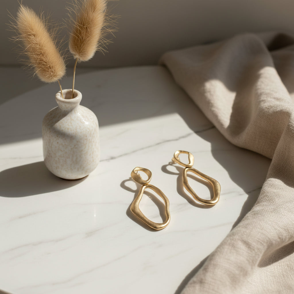 Gold earrings on a white background