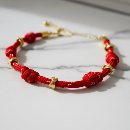 BRACELET RED STRING KNOTS AND GOLDEN RINGS