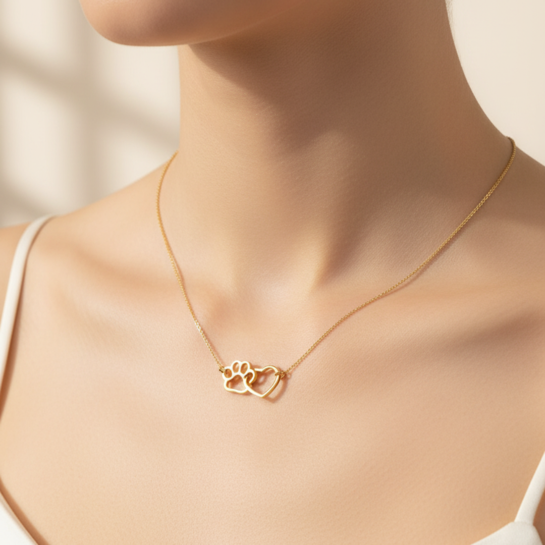Gold necklace with a heart pendant on a mannequin